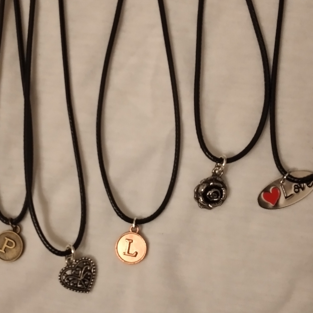 Pretty black necklaces with cute charms.